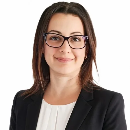 A professional woman, Michelle Newman, is pictured in a business portrait.